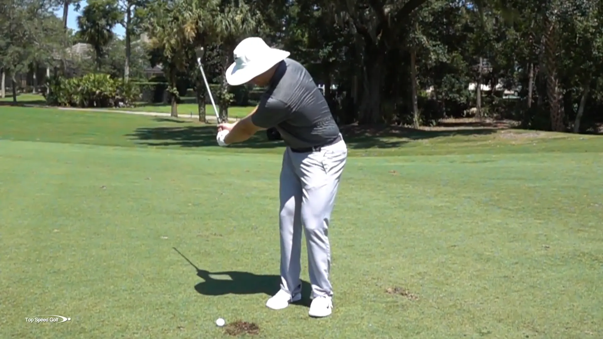Leading with hands during a wedge shot