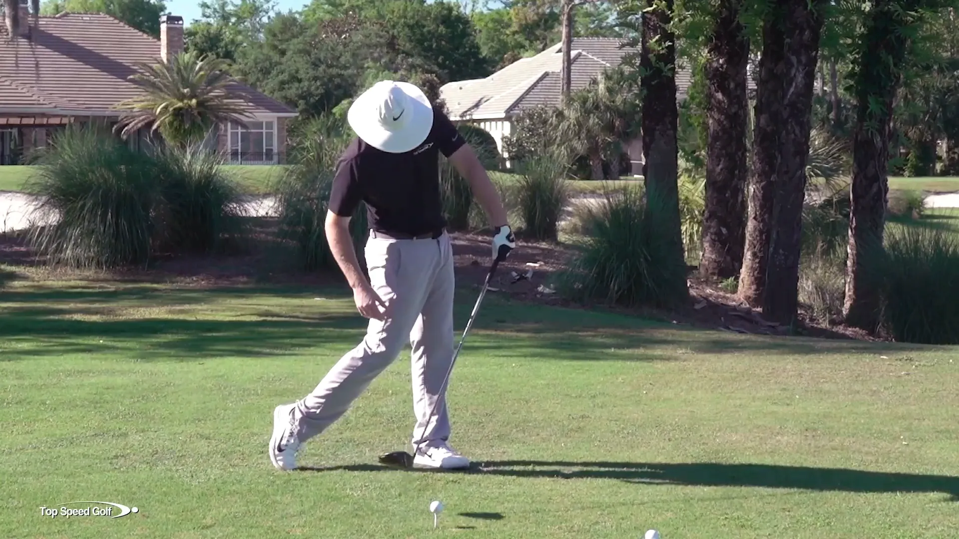 Demonstrating body movement in the swing
