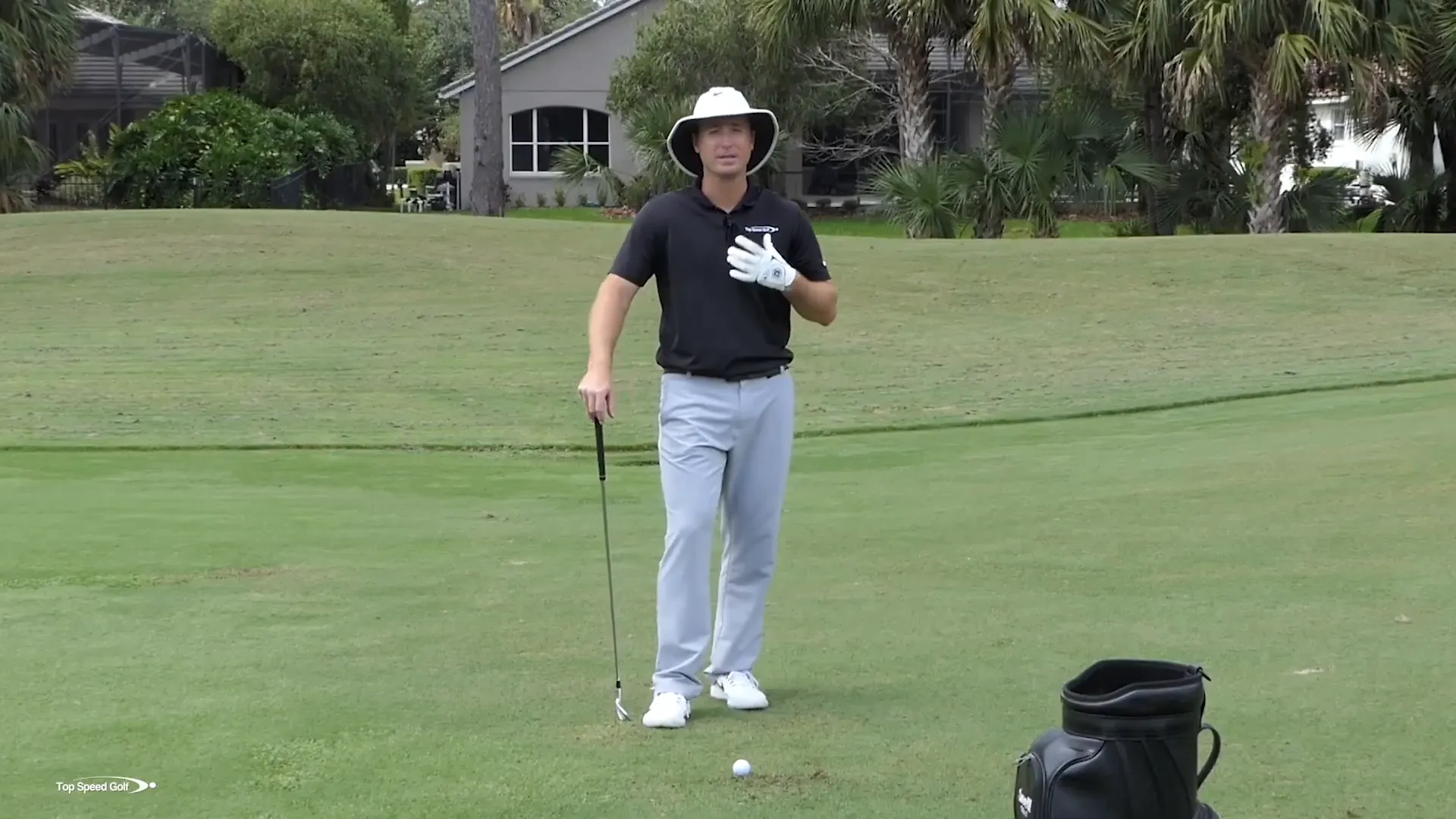 Demonstrating full swing mechanics