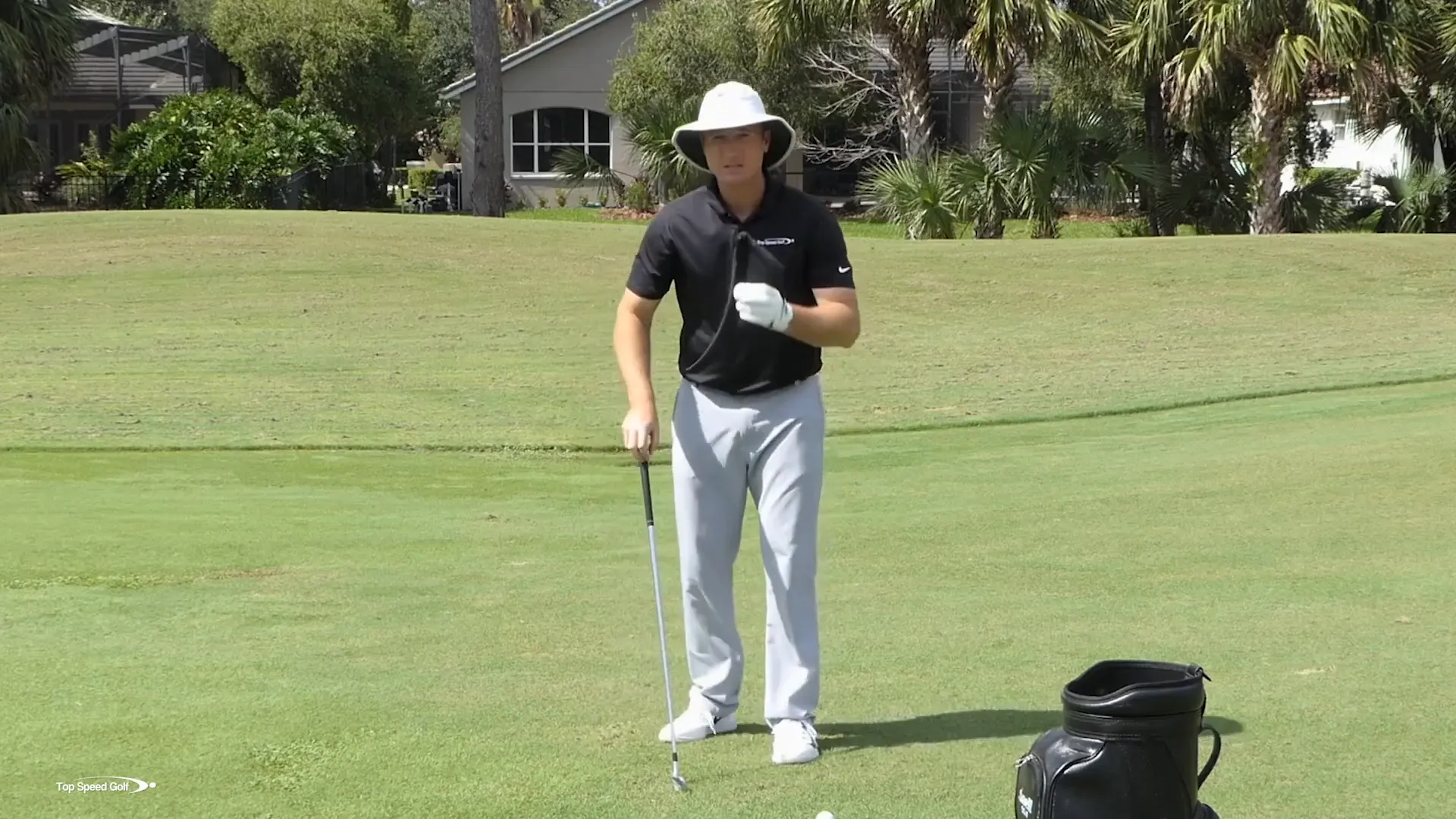 Demonstrating wrist position for closing the club face
