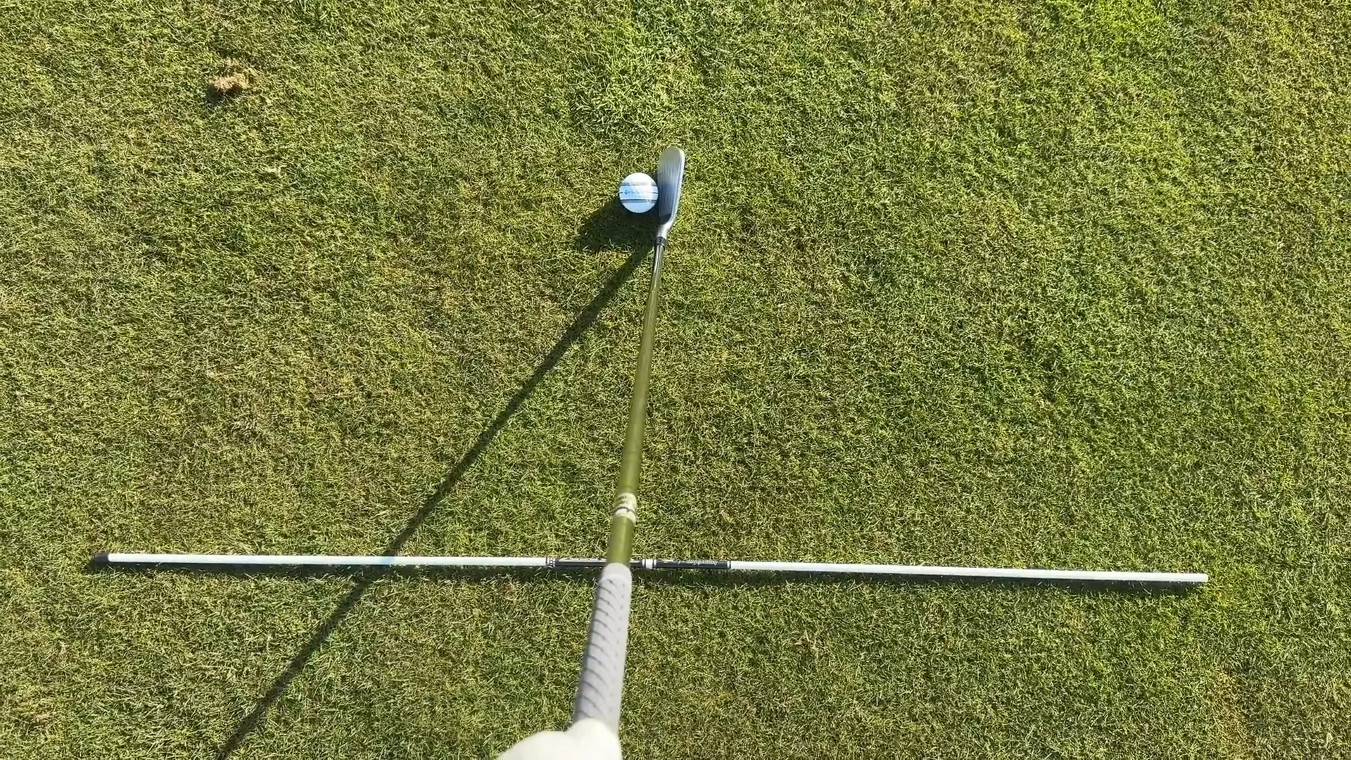 Setting up with an alignment stick for practice