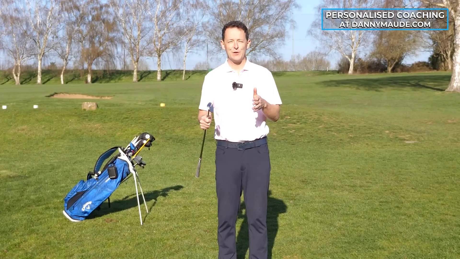 Demonstrating the "putt with loft" technique
