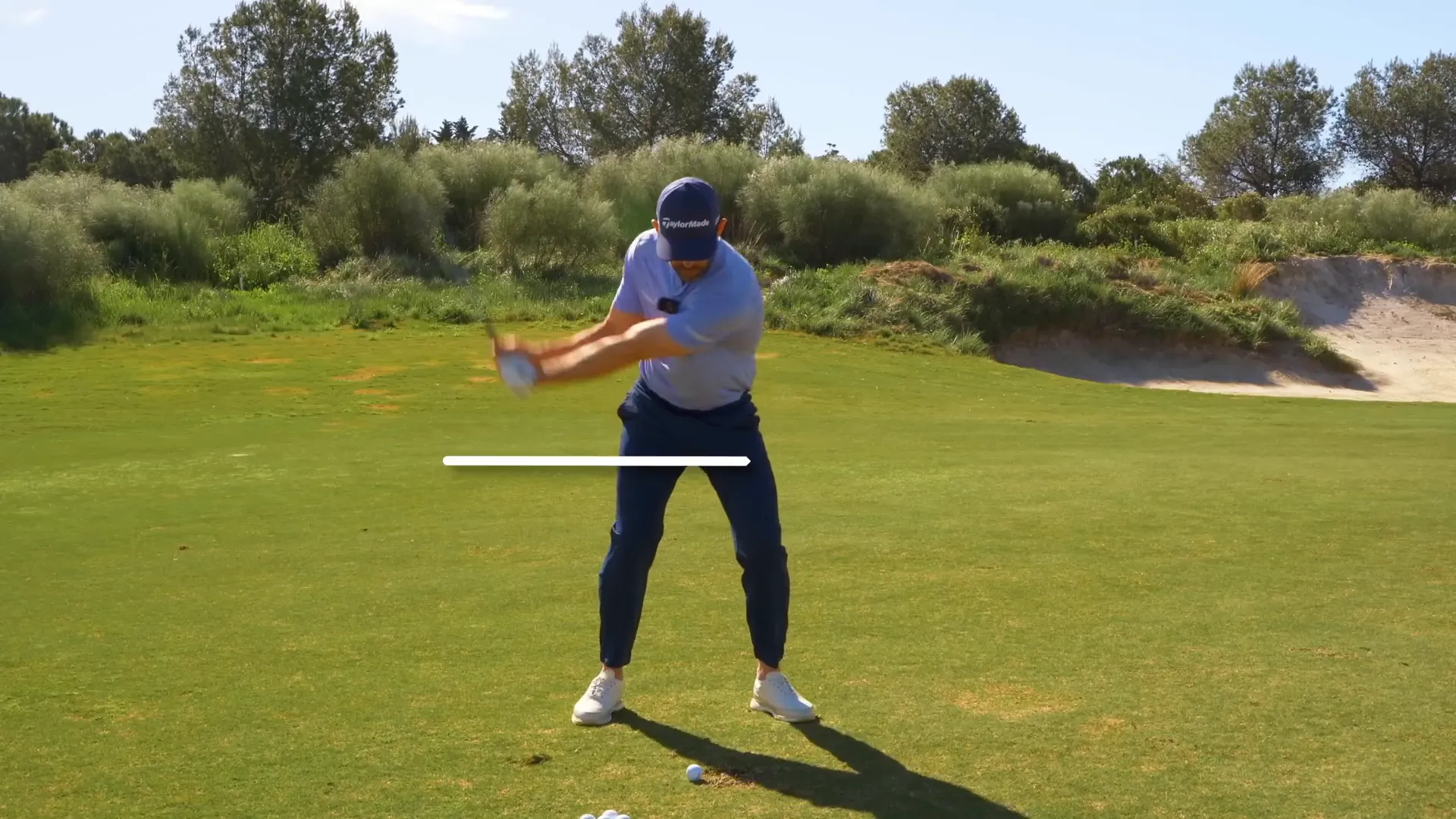 Practicing the swing with a focus on grip height.