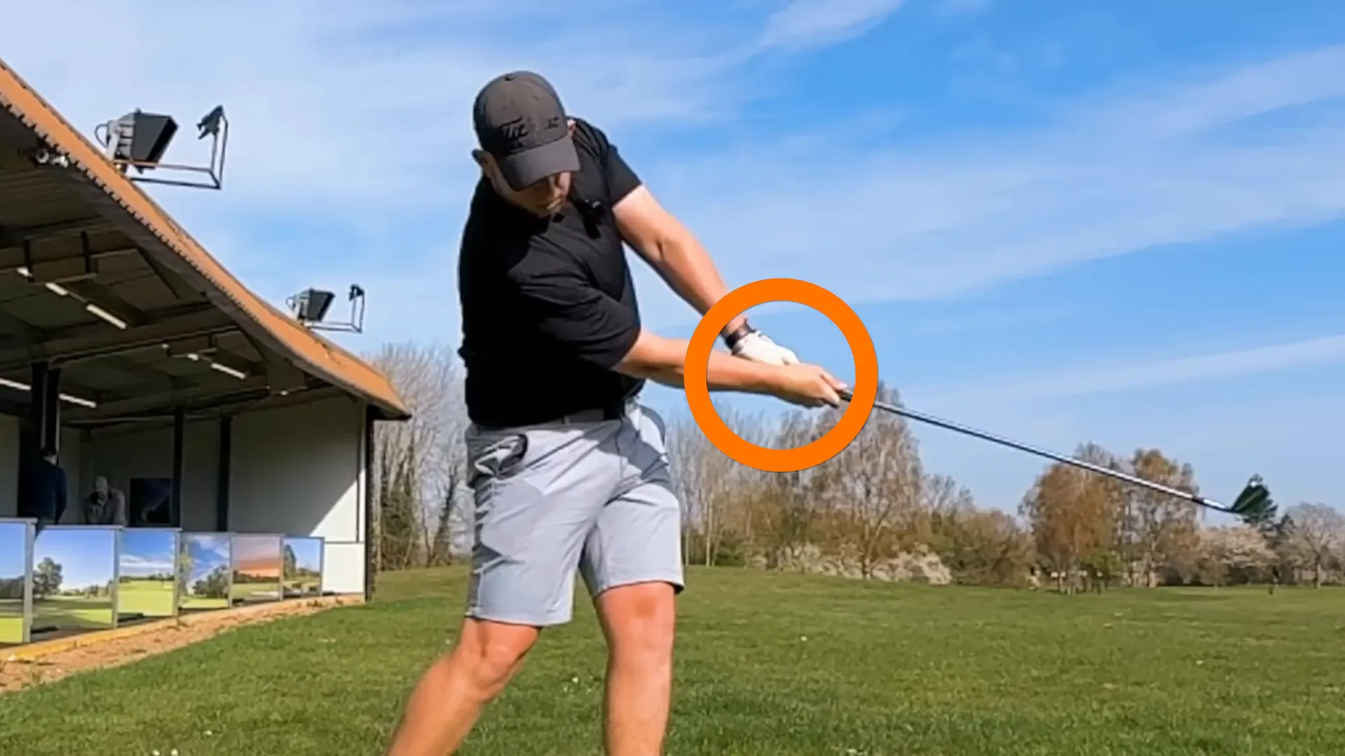Demonstrating hand position at impact