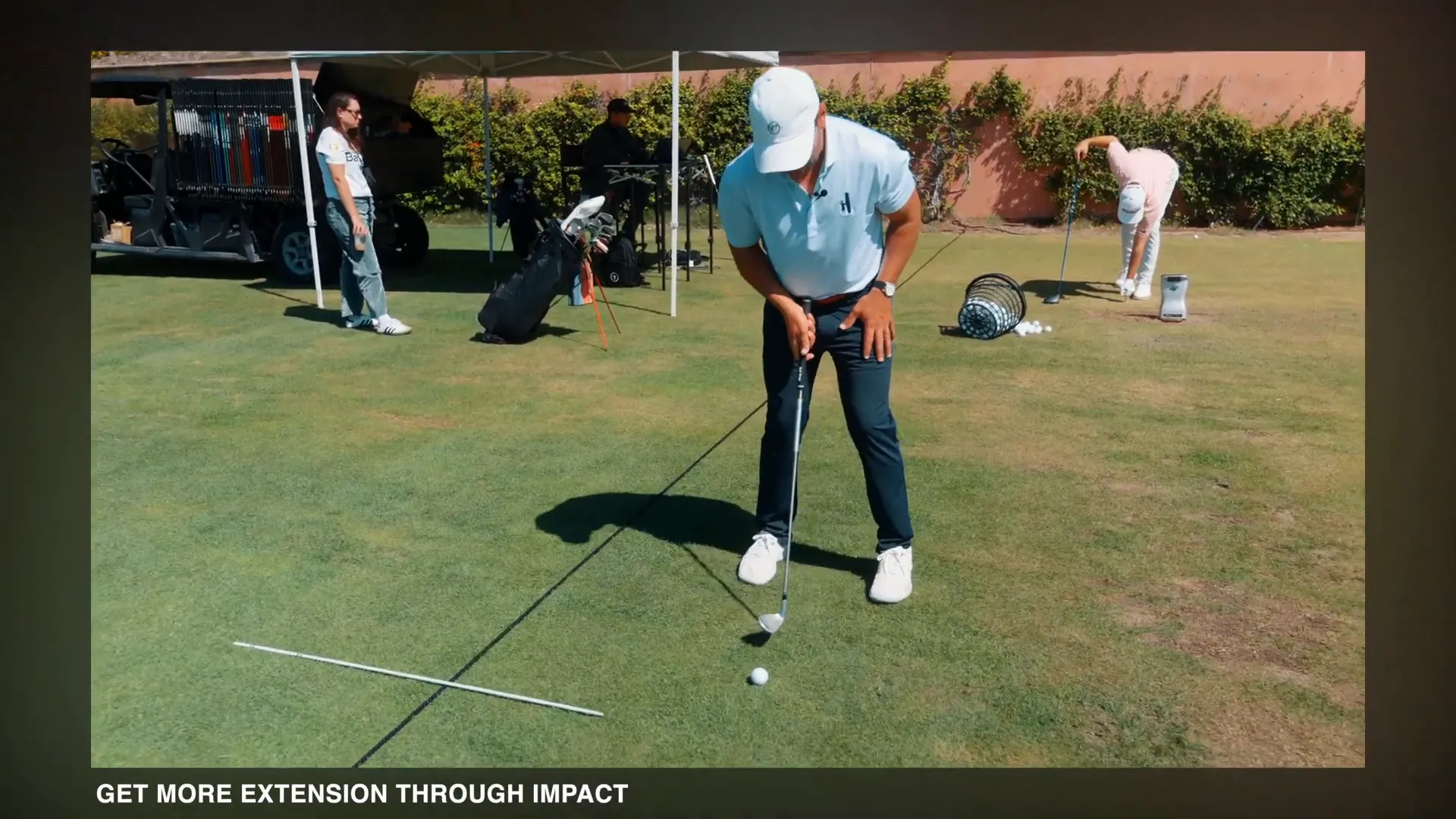 Demonstration of ball forward in stance for knockdown shot