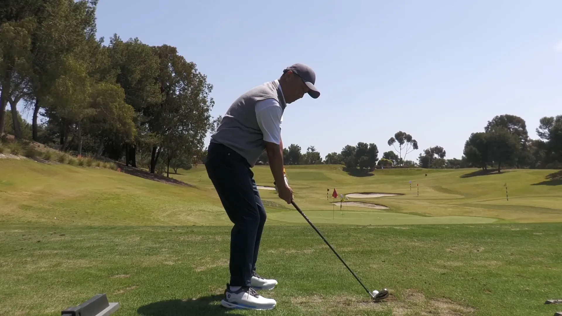 Demonstration of maintaining posture during the swing
