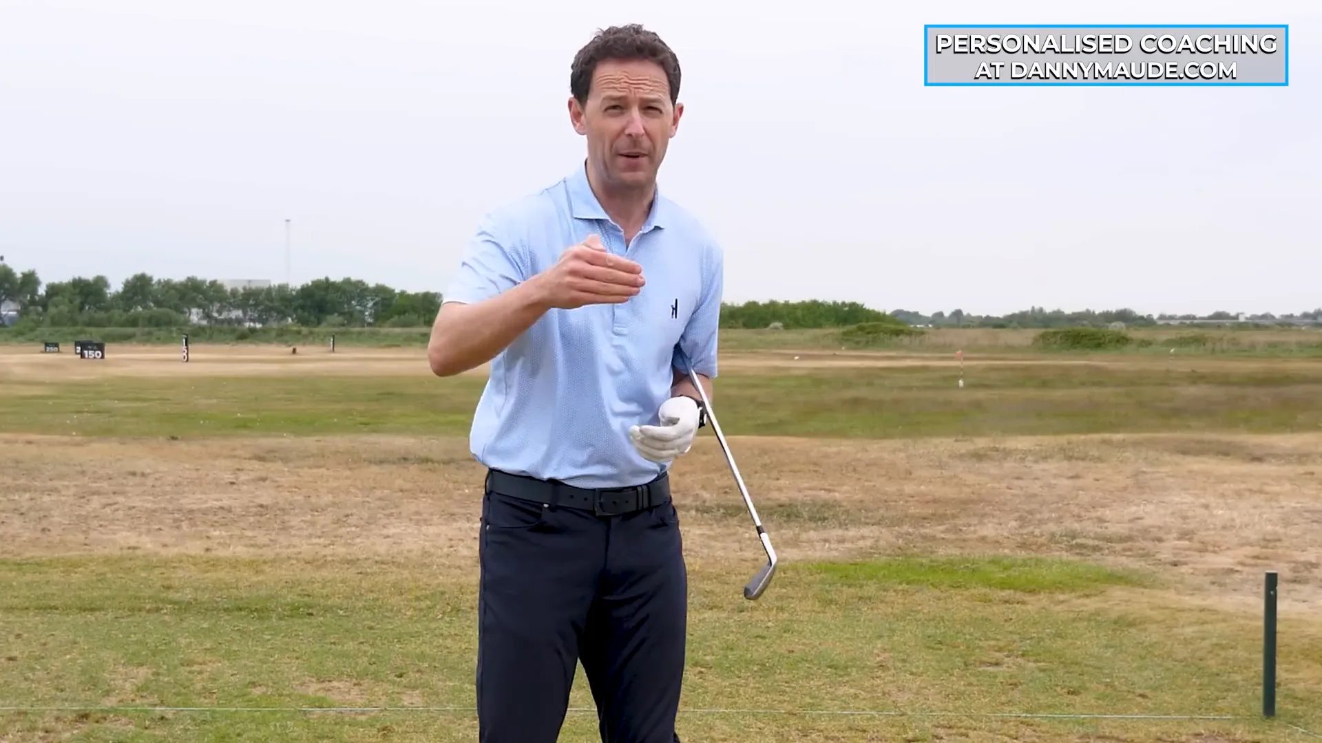 Confident golfer hitting a perfect iron shot