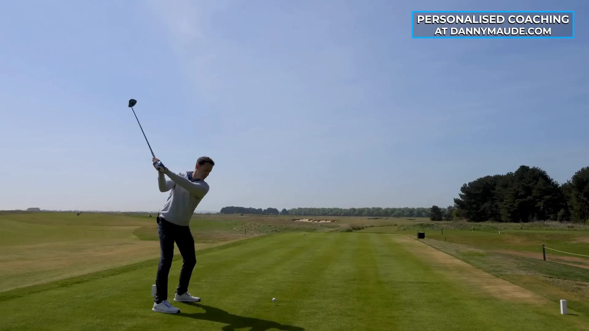 Golfer preparing to hit a smooth driver shot