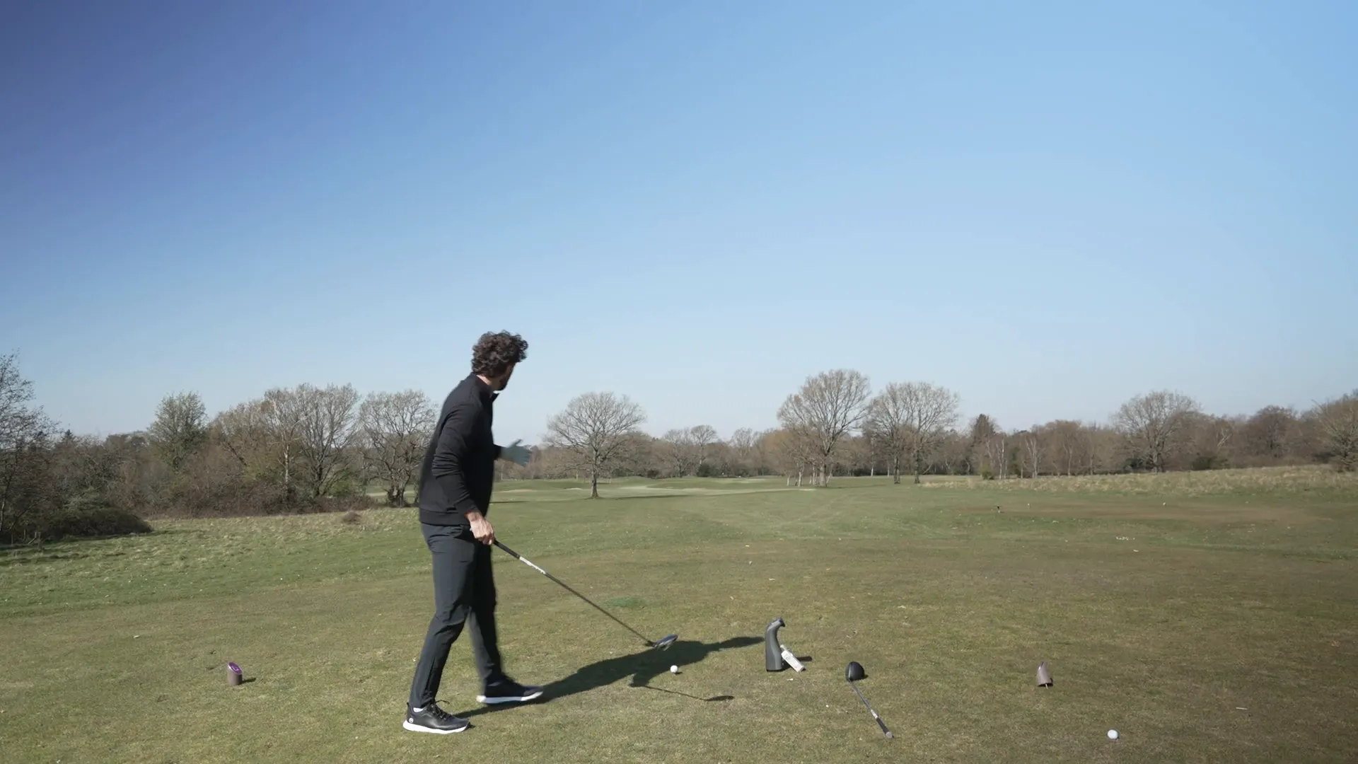 Swinging the Elyte Mini Driver on the range, ball flight high and pumped