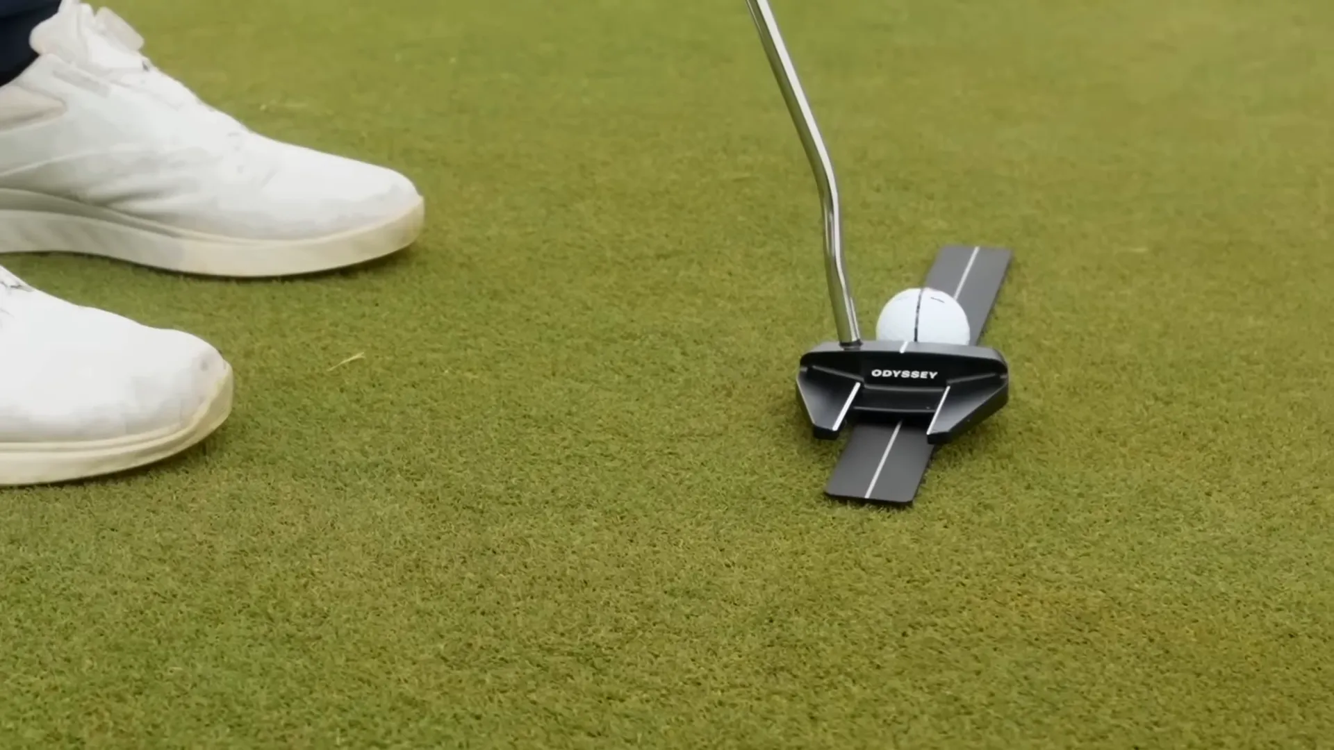 Practice aid groove slightly holding the ball in place for consistent starting position