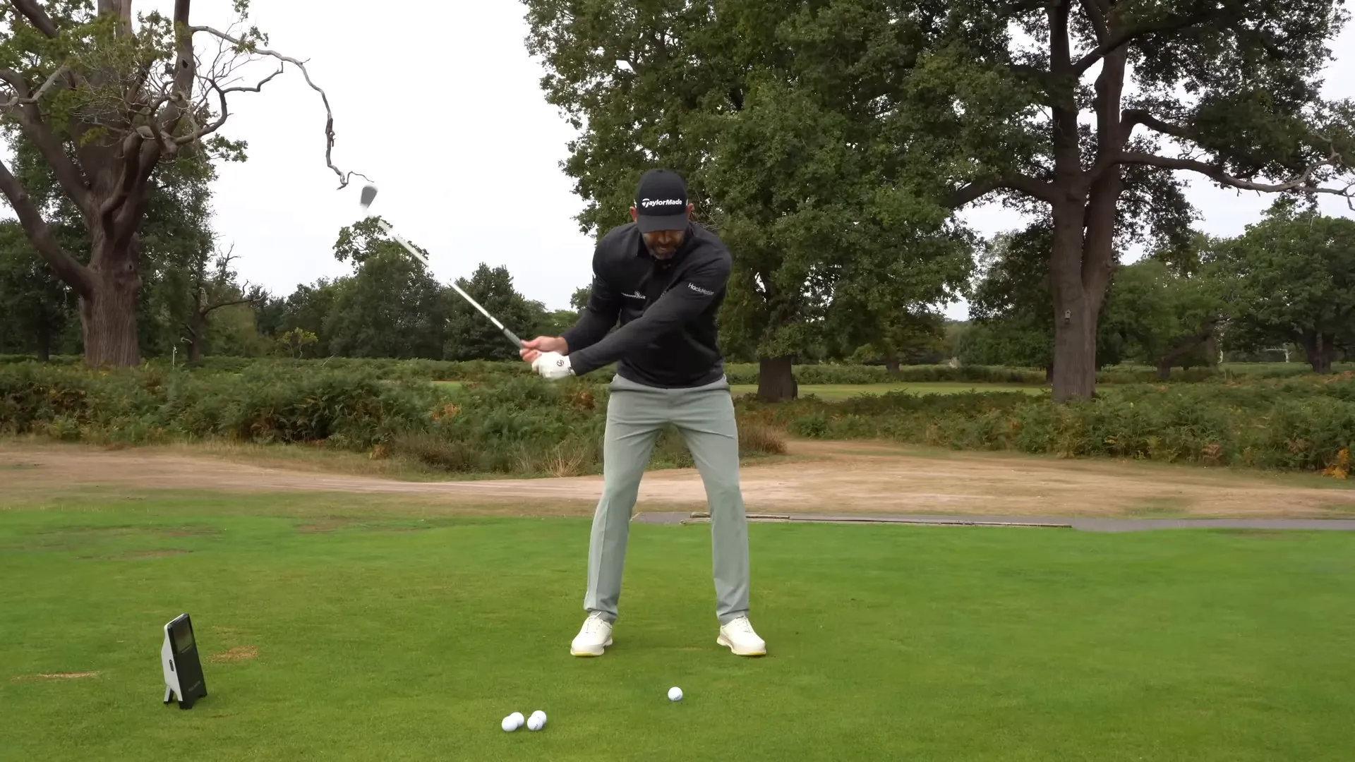 Side view showing player maintaining balance during early takeaway