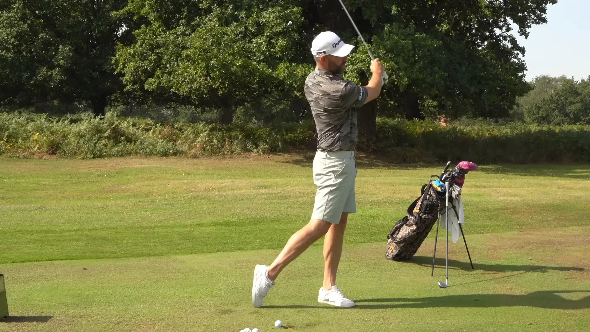 Performing a downswing step drill by stepping into the downswing before the club completes its turn