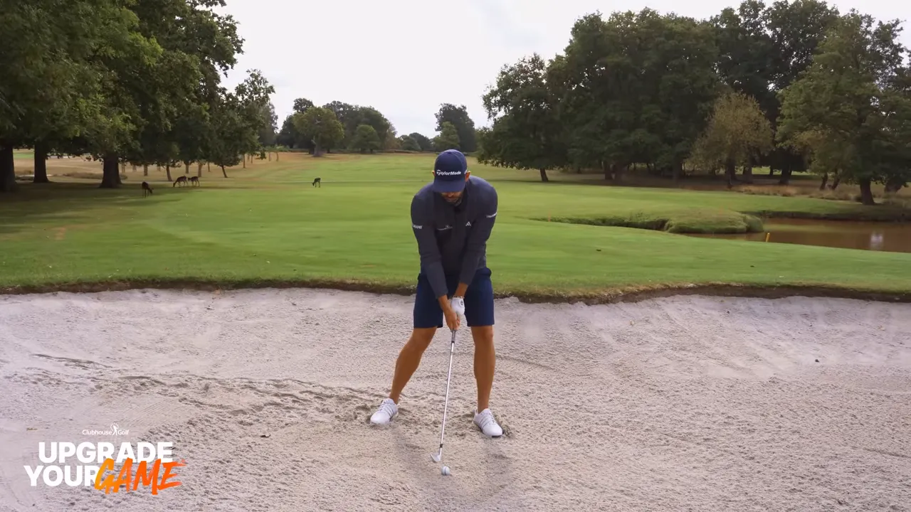Impact point in the sand: 2-3 inches before the ball