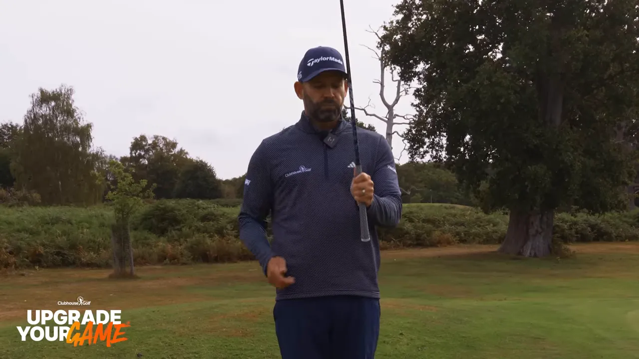 Grip change for 5-wood chip: lead hand low, trail hand on shaft