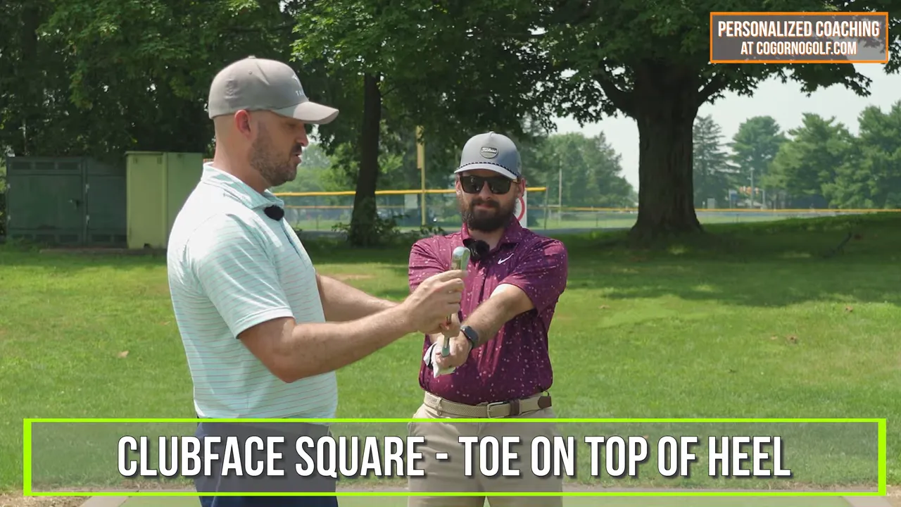 Coach holding club showing toe on top of heel as a square clubface reference