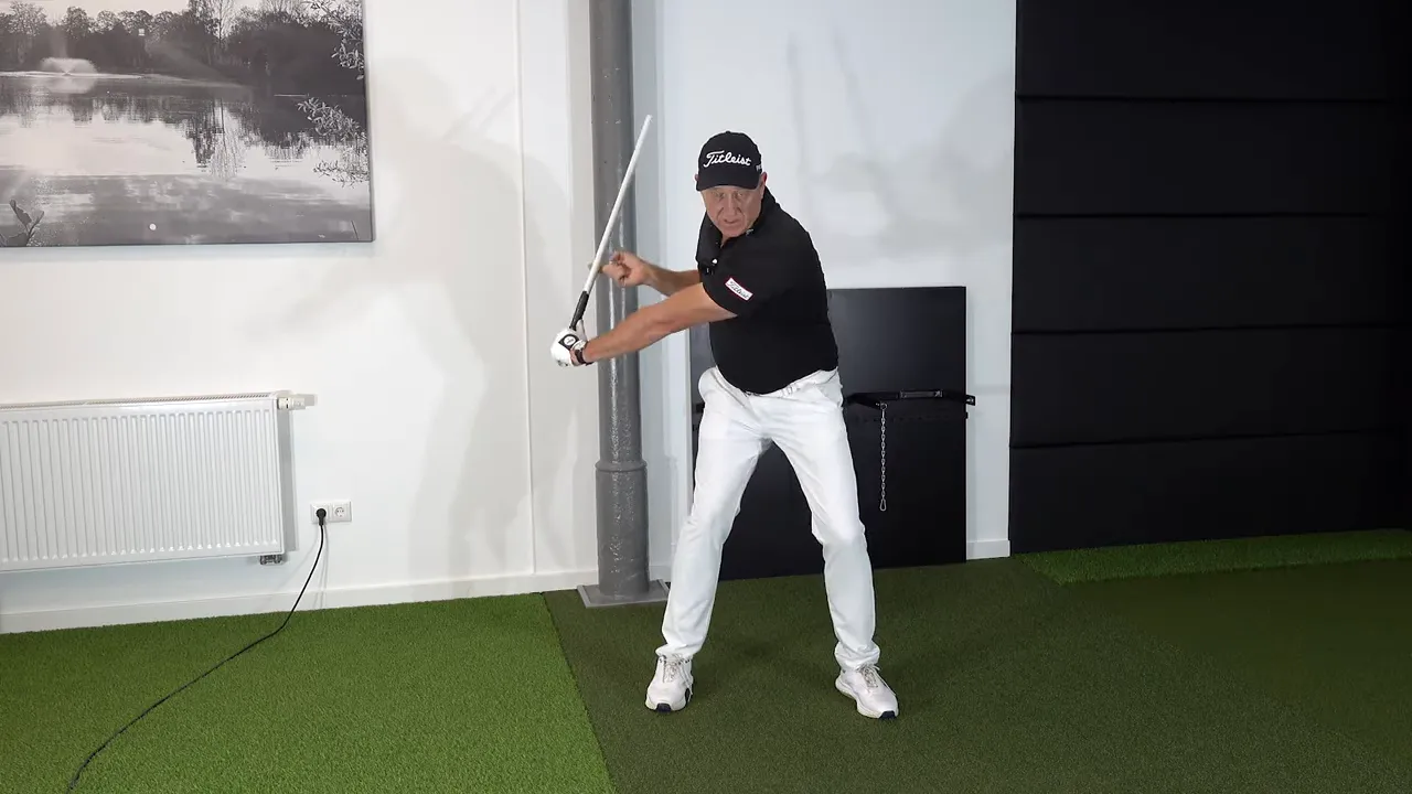 Whipping the training stick through with a large wrist hinge