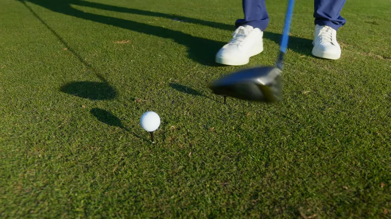 Host explaining tee height strategy for uphill and downhill holes