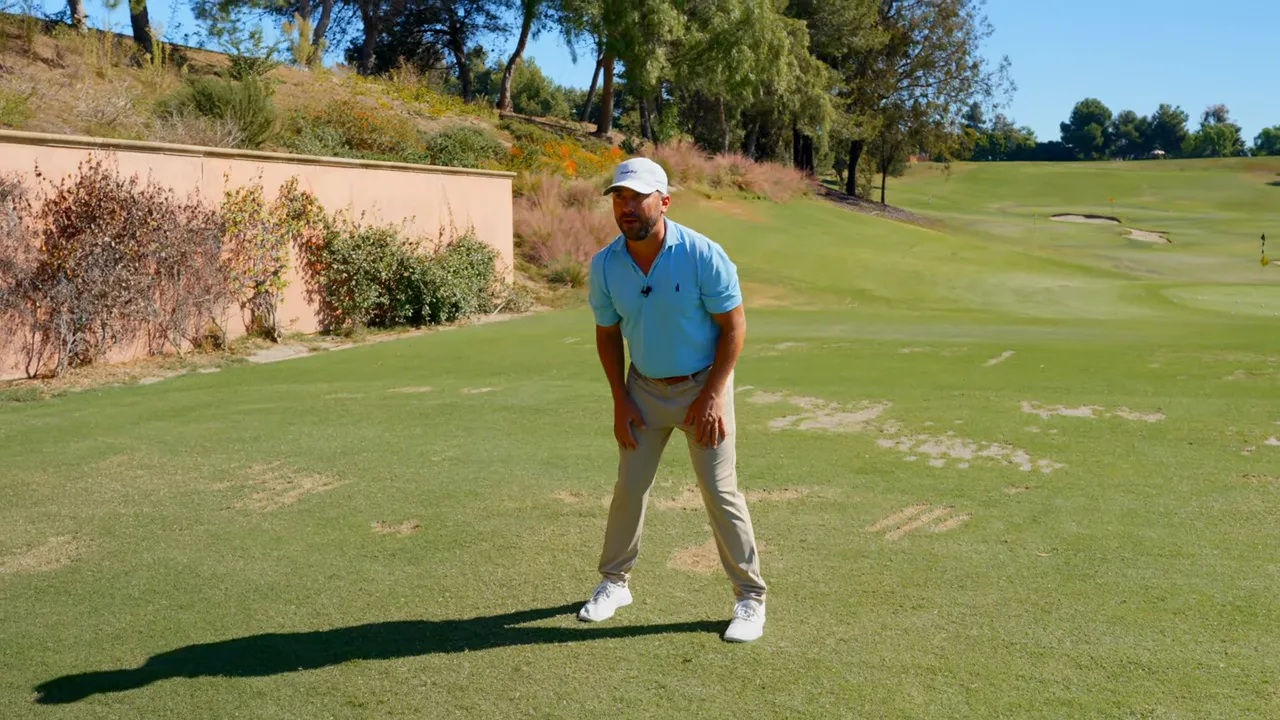 Instructor explaining keeping head in picture frame behind the ball reduces sliding