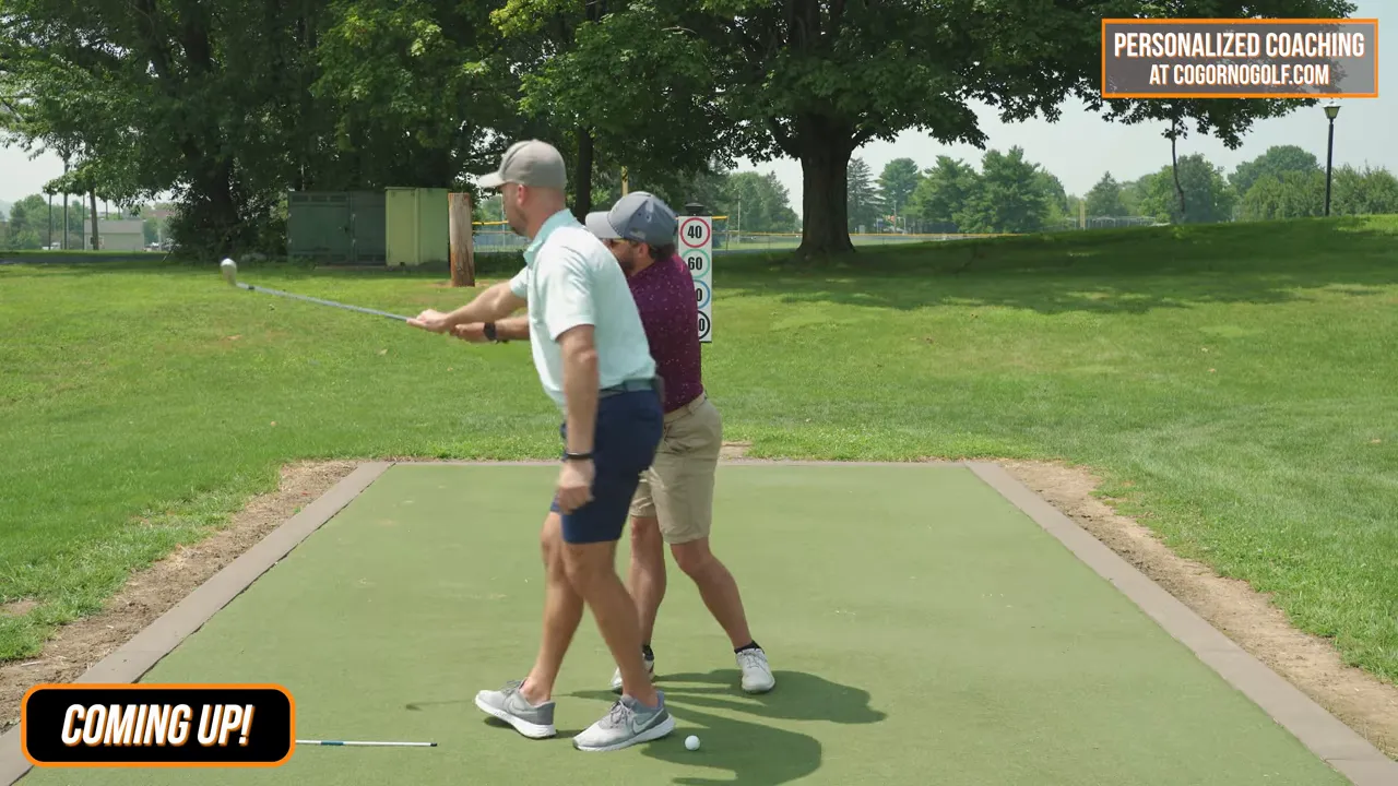Instructor demonstrating butt of the club pushed away creating a long arc