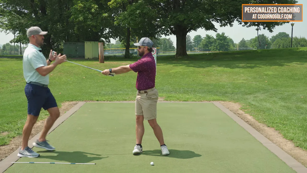 No backswing drill shown with butt of club pushed away and body rotation