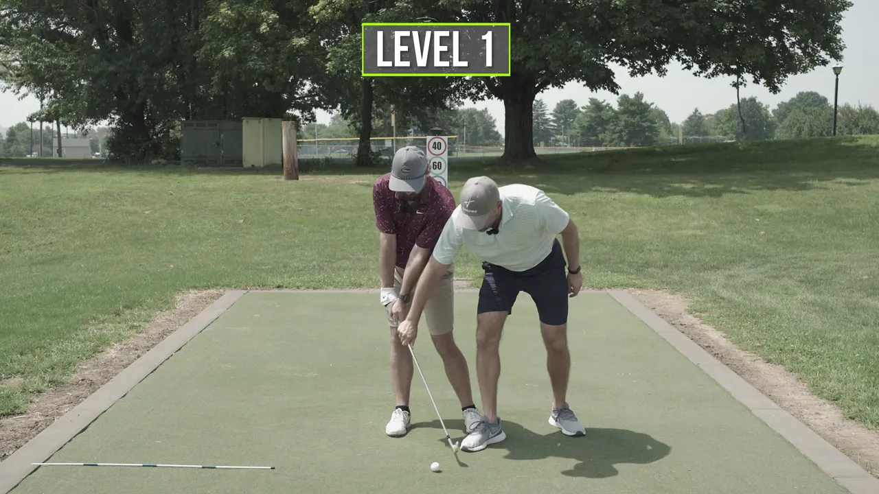 Club parallel to ground drill with instructor cueing clip the mat