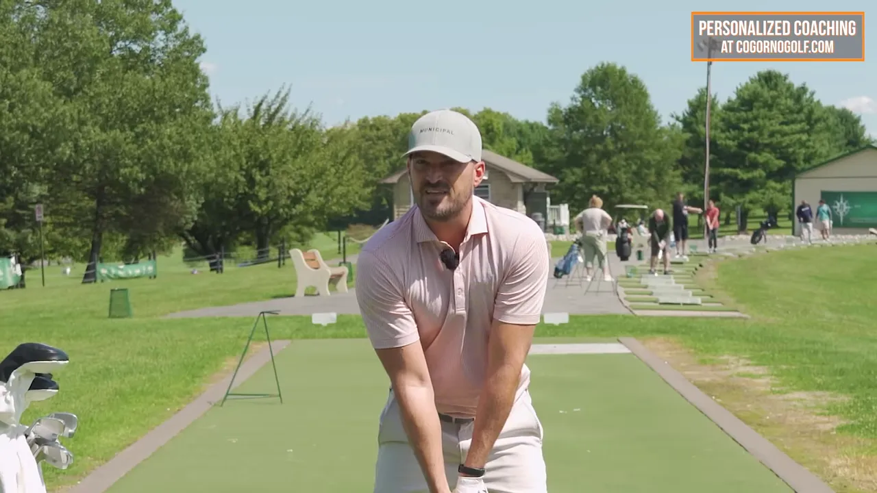Golfer at address showing face, shoulders, and arms
