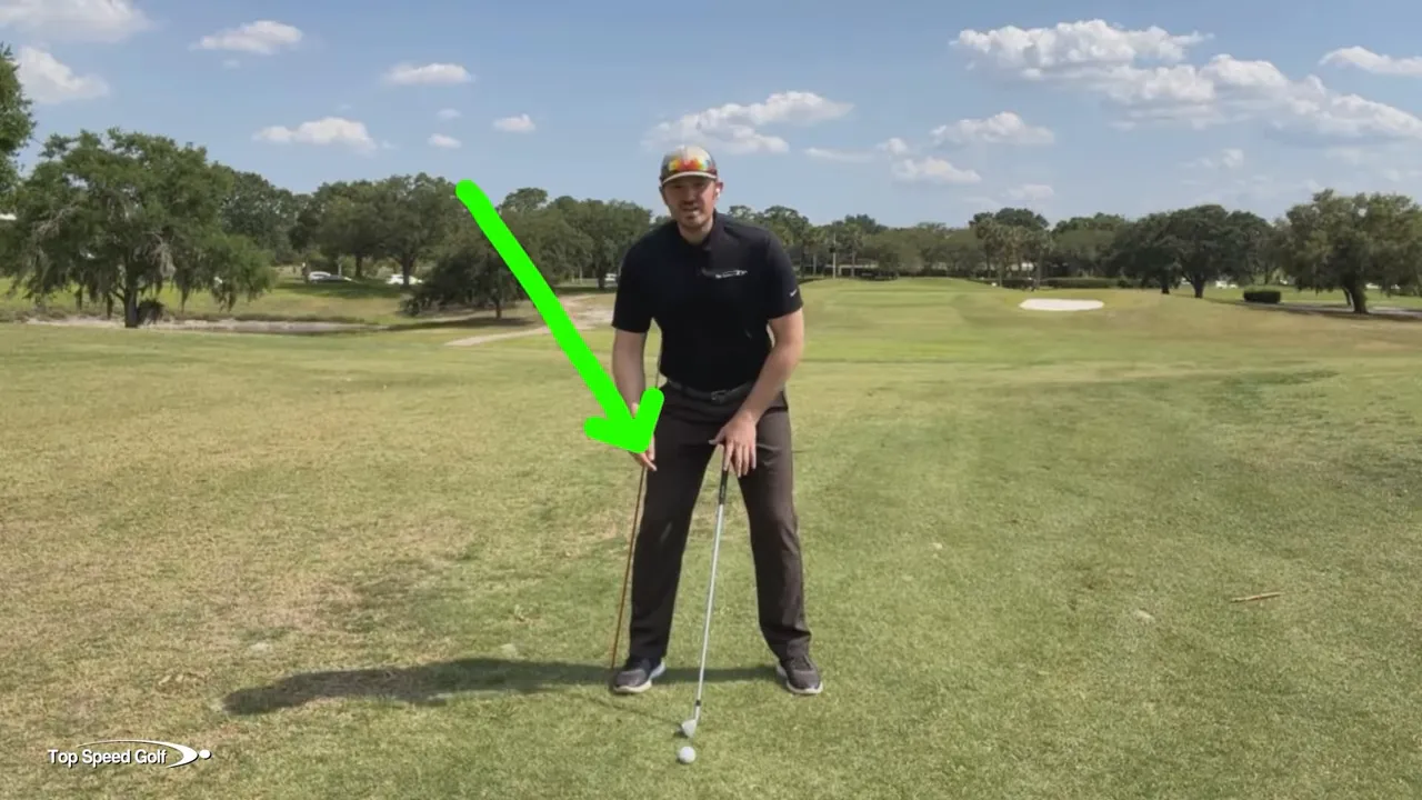 Alignment stick placed at mid thigh behind the back leg