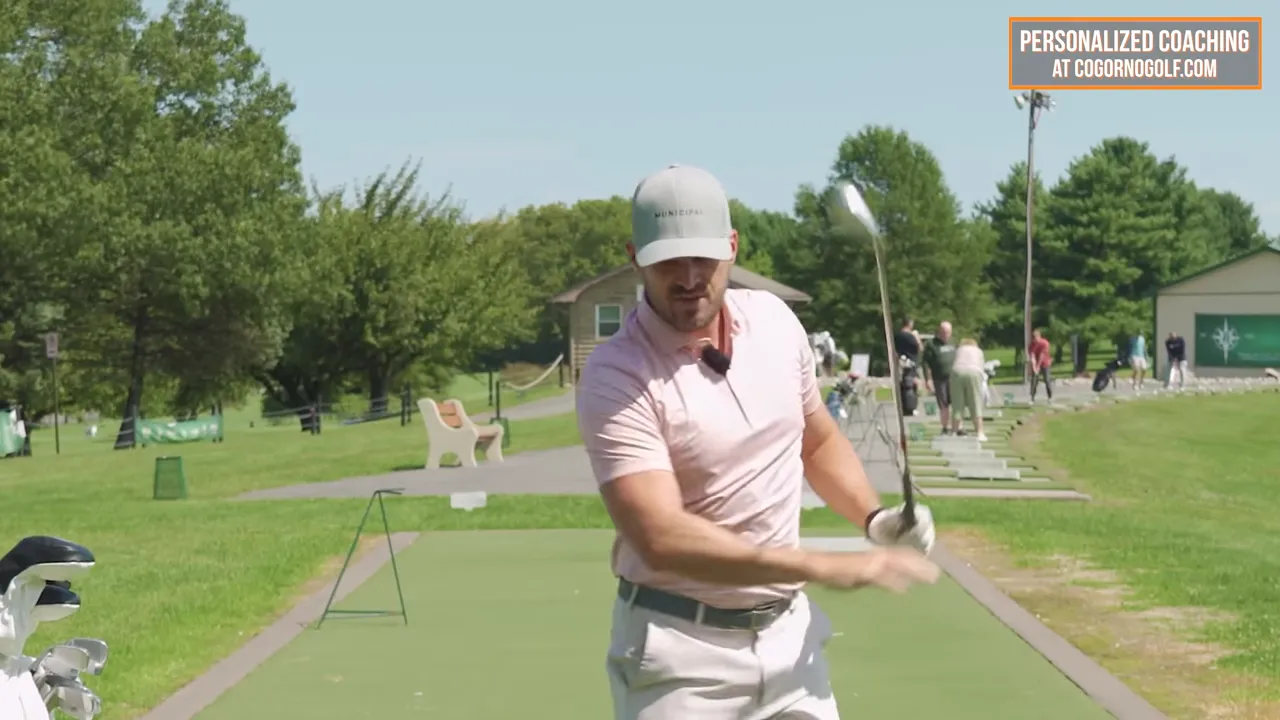 Close-up view of golf instructor's hands and club