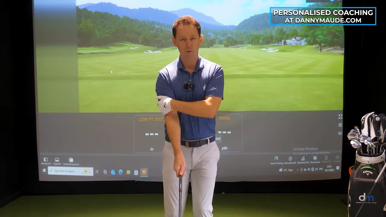 Instructor pinching left tricep to chest demonstrating the lead tricep lock drill