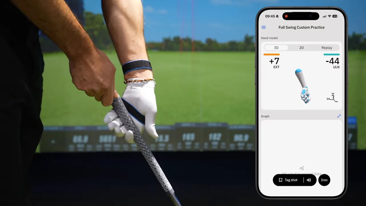 clear close-up of golf lead hand holding grip in the base of the fingers showing wrist set at address