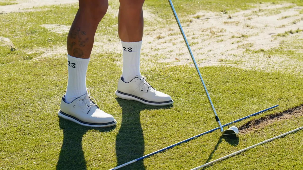 Golfer's stance with alignment sticks