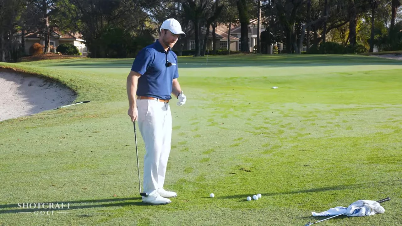 Golf chipping distance practice with markers on the grass using stroke length