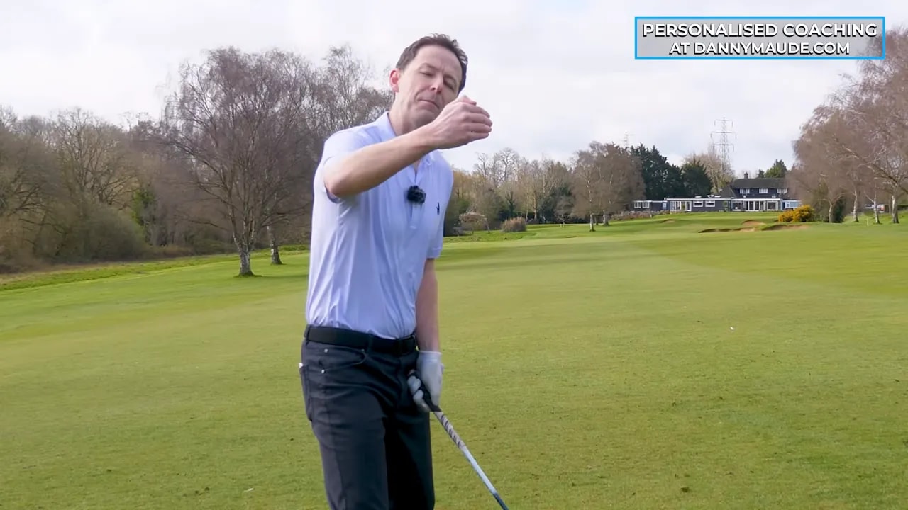 Coach explaining the restricted feel when learning the prop drill for fairway woods