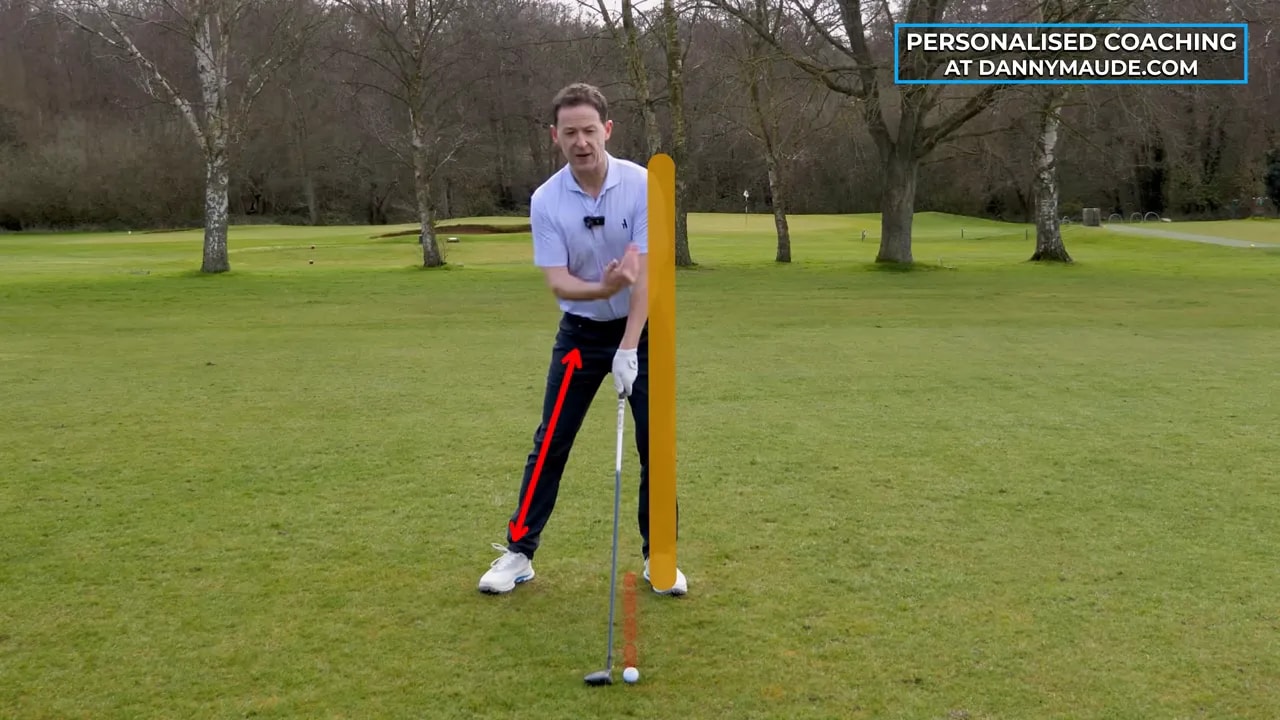 Golfer demonstrates trail leg propping position for fairway wood drill
