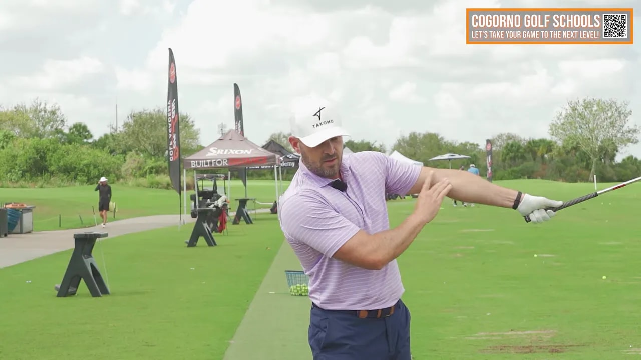 Golf lead-arm rotation checkpoint showing slight fold in lead arm rather than locking straight