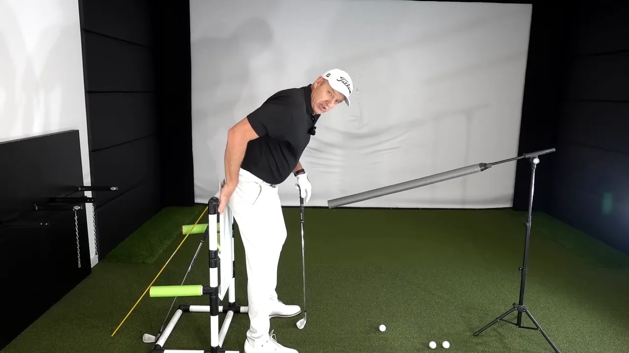 Instructor demonstrating the left hip pushed out toward a 45-degree corner to create pivot depth