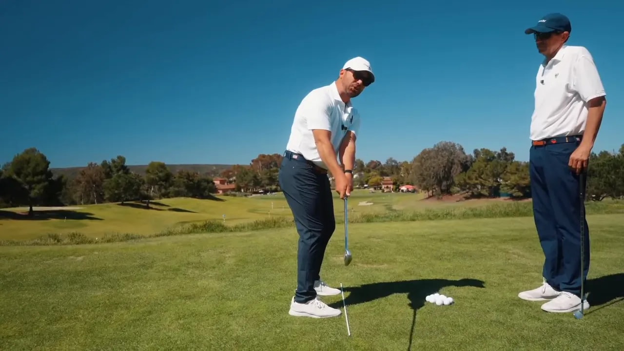 golfer demonstrating a proper hinge with the club shaft rising in front of the trail forearm at pocket height