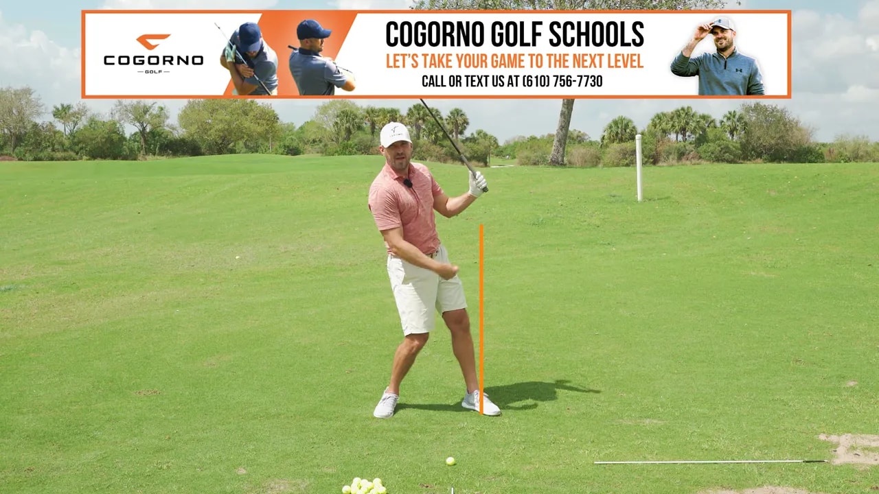 Golfer demonstrating belt buckle over lead ankle checkpoint through impact with a 3-wood