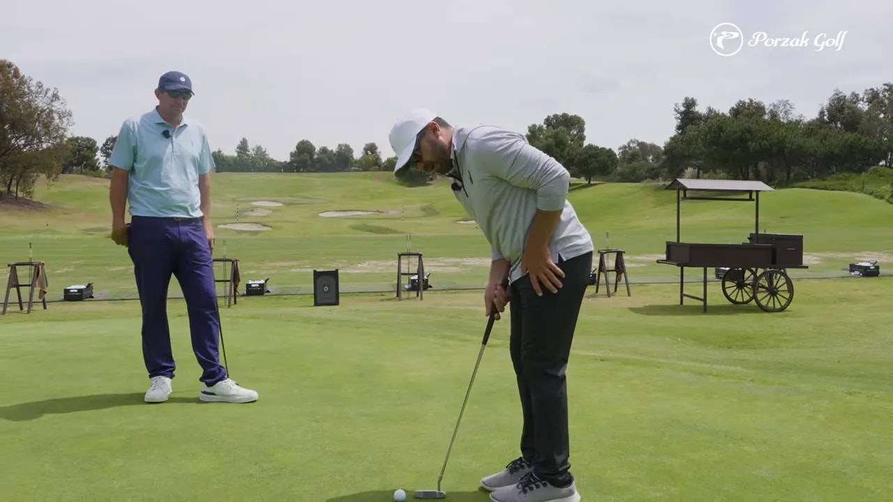 Golfer bending into putting setup after a calming breath before stroking the ball