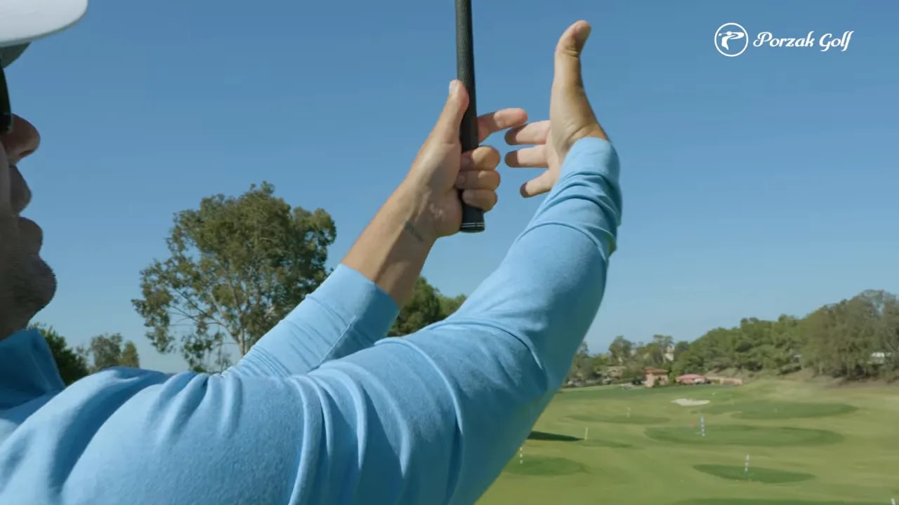 Close-up of golfer grip showing connected hand pressure for better golf compression