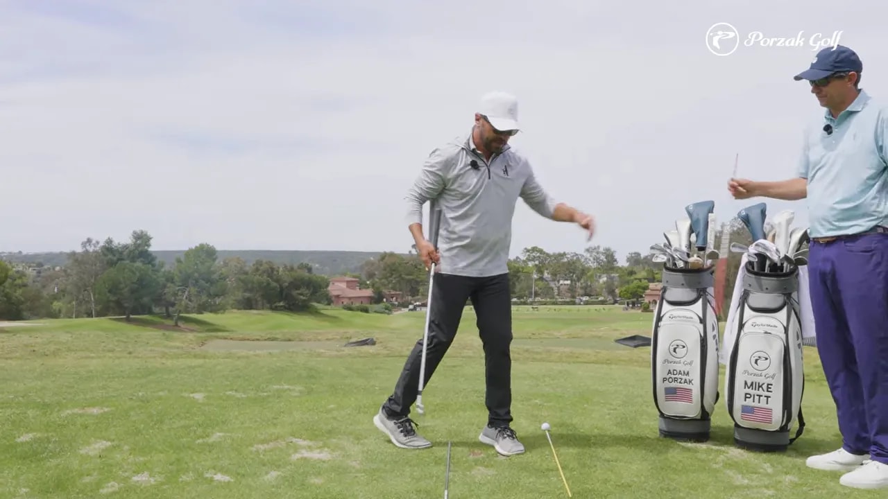 Golfer demonstrating a connected backswing takeaway with hands staying aligned to the body turn