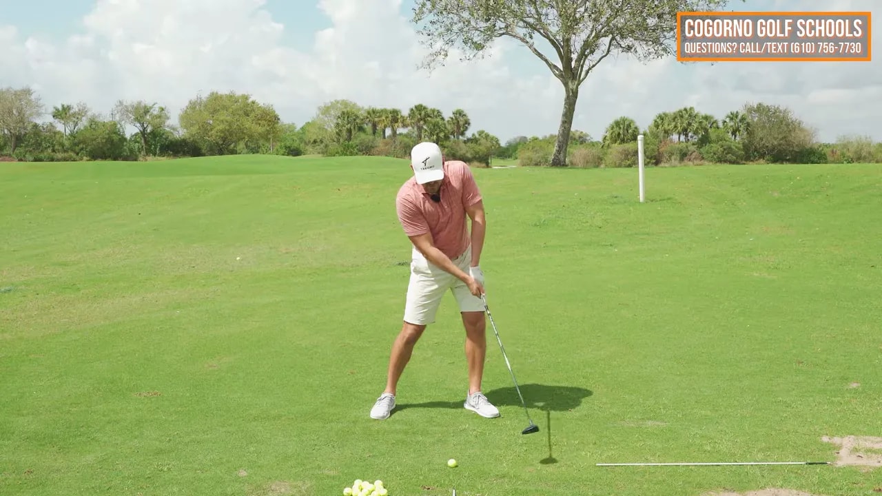 Golfer showing fairway wood extension through impact with weight shifting forward on the lead side