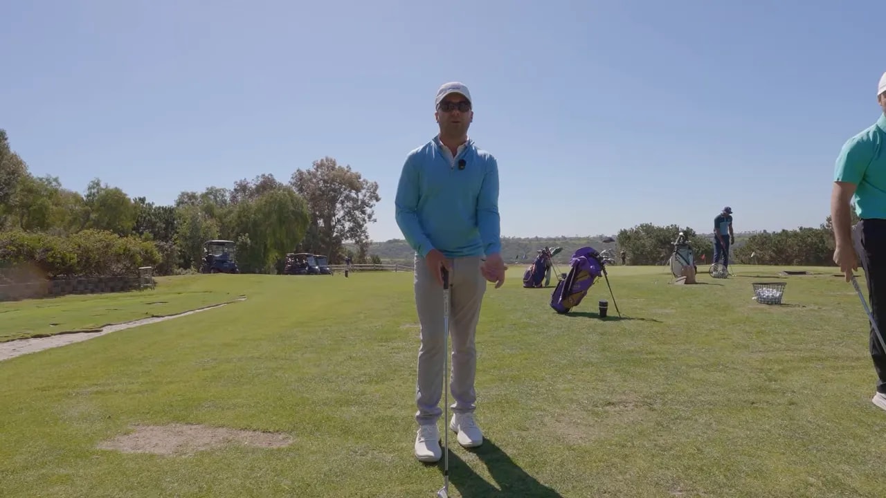 Golf instructor demonstrating proper golf grip