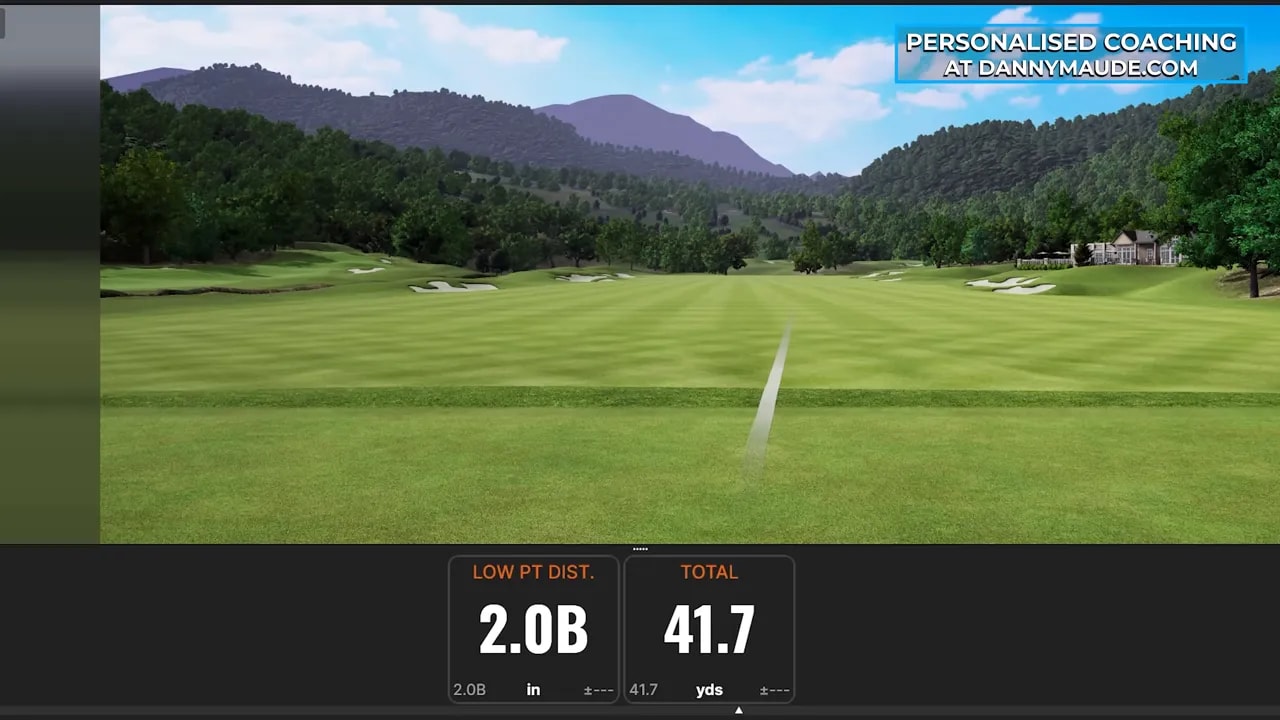 Golf simulator display showing low point distance and total yardage feedback