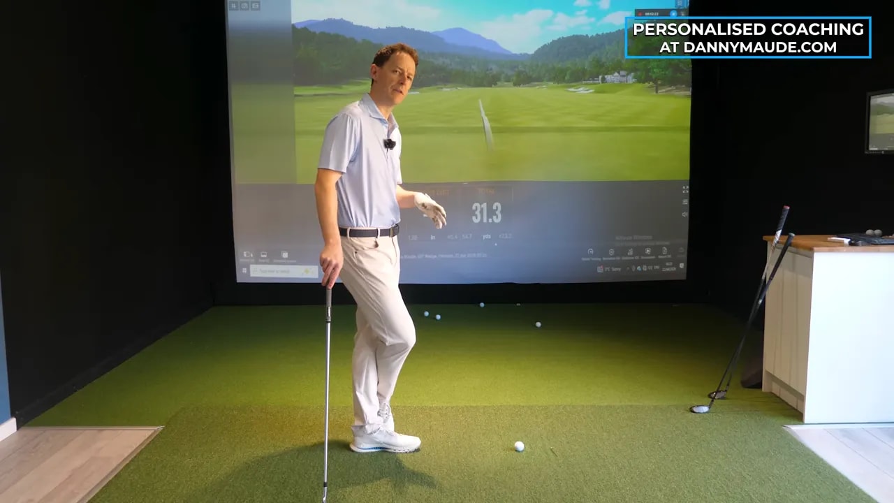 Coach explaining how to improve ball striking by reading club-ground interaction