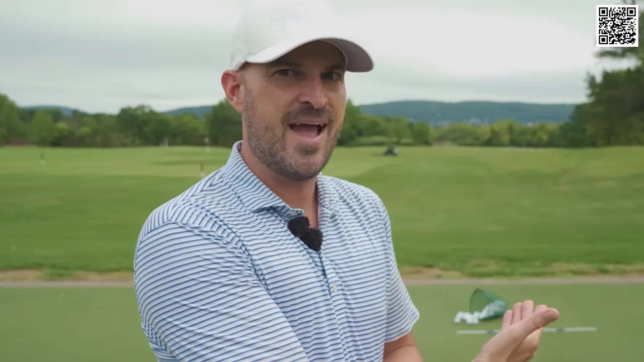 Instructor explaining how AI app feedback helps improve shaft lean during golf swing practice