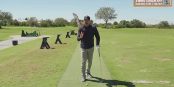 Instructor explaining hips-forward downswing concept on a golf practice range