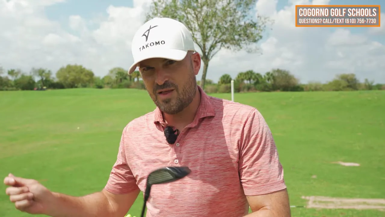 Golf coach holding a club and talking about the simple swing thought for fairway woods off the ground