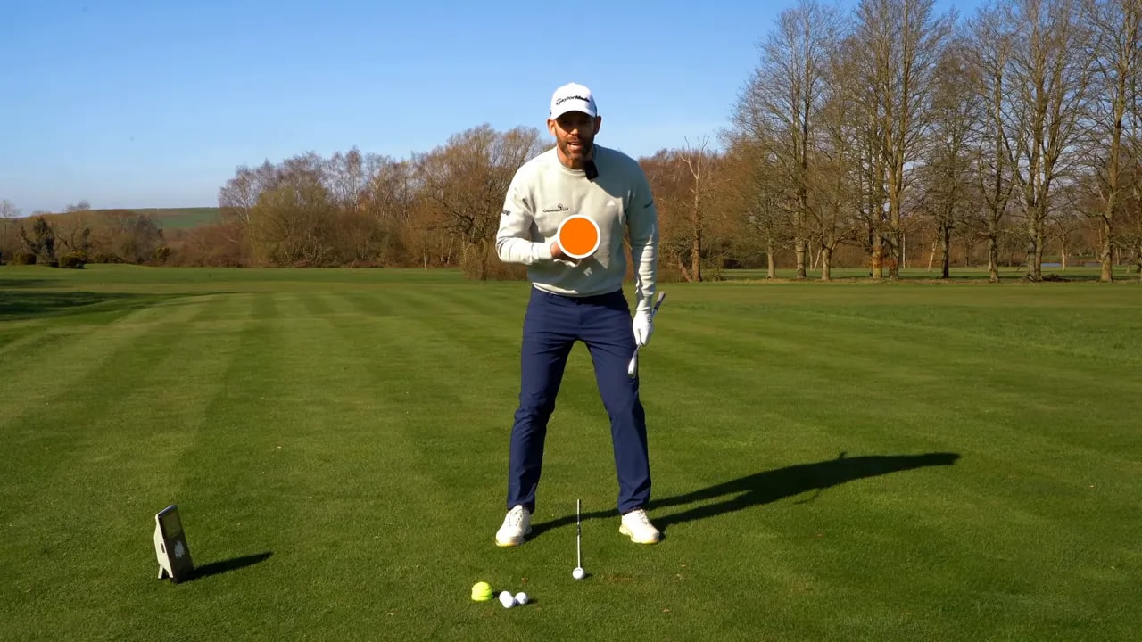 Golfer demonstrating slight lead-side pressure at address for better swing feel