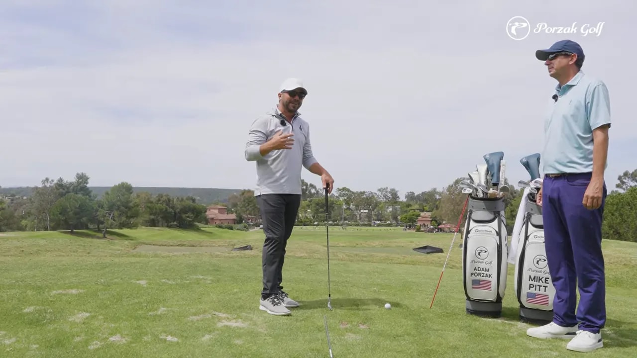 Golfer using sternum checkpoint to keep hands in front of body center